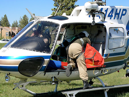 Securing the rescue litter in the helicopter