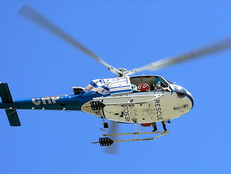 Litter extends out both sides of the helicopter