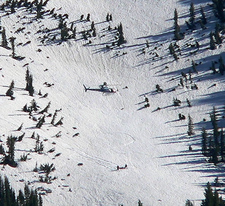 Helicopter ready to hoist victim in litter