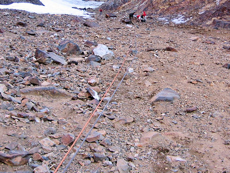 Belay line down over the bolders to the snow slope