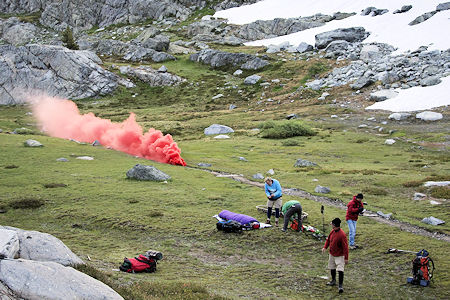 Smoke plume tells incoming helicopter pilot about the wind