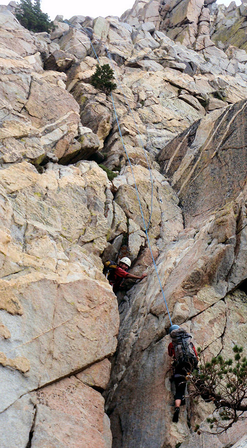 Team climbing to subject