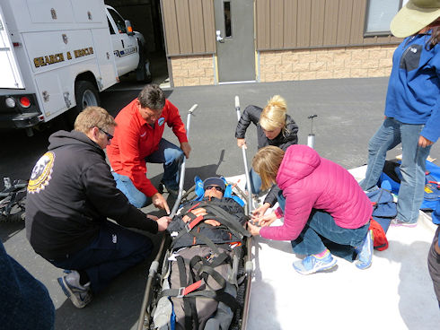 Victim is packaged in the litter - getting ready to add the wheel