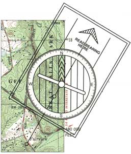 Showing a section of a topographic map with the compass aligned along the drawn line to read the compass on the map