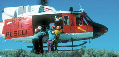 Team members loading helicopter - Gary Guenther Photo